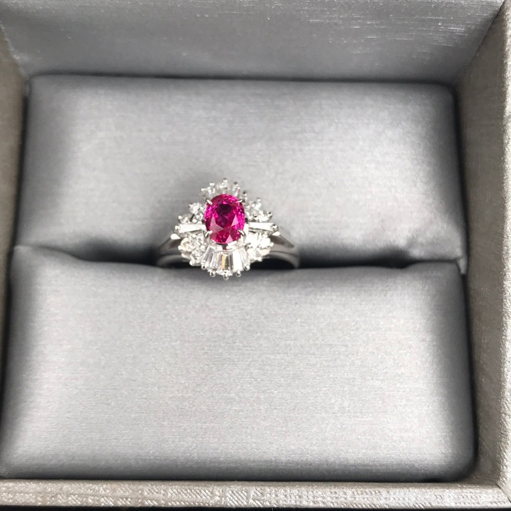 platinum with beautiful fushia red ruby with diamonds,  the real deal.